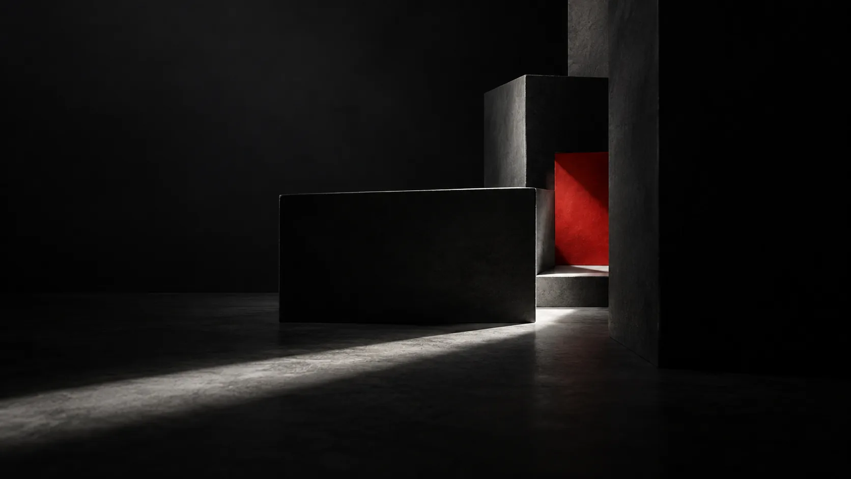 Una luce rossa che esce da un volume scuro in una stanza buia